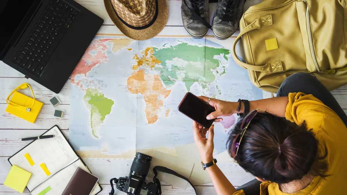 Planning a trip destination with maps and a mood board