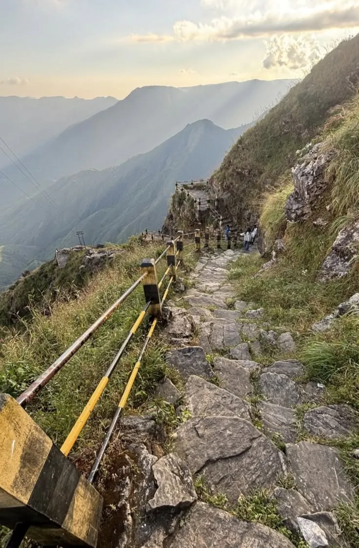 Grass ridge and dropping gorges at Laitlum in the East Khasi Hills with cloud in the valley