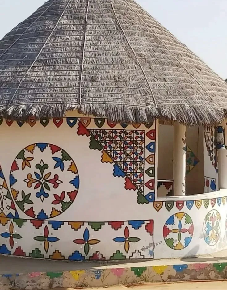 Painted mud bhunga huts in a craft village on the Khavda road in Kutch
