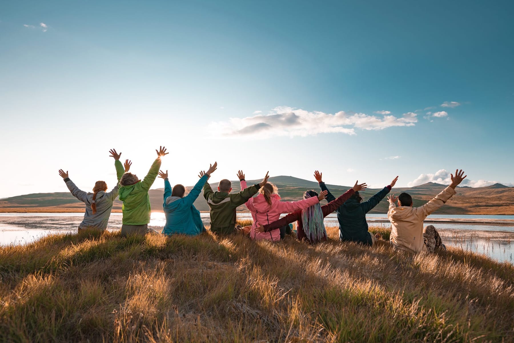 A group of travellers taking in a mountain view together